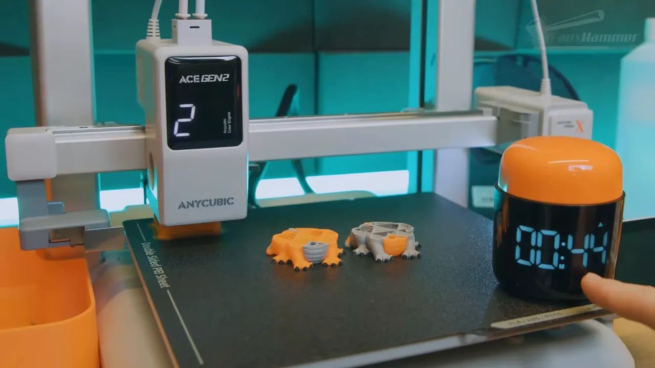 Anycubic Kobra X showing multi-colour print parts with a purge waste bin