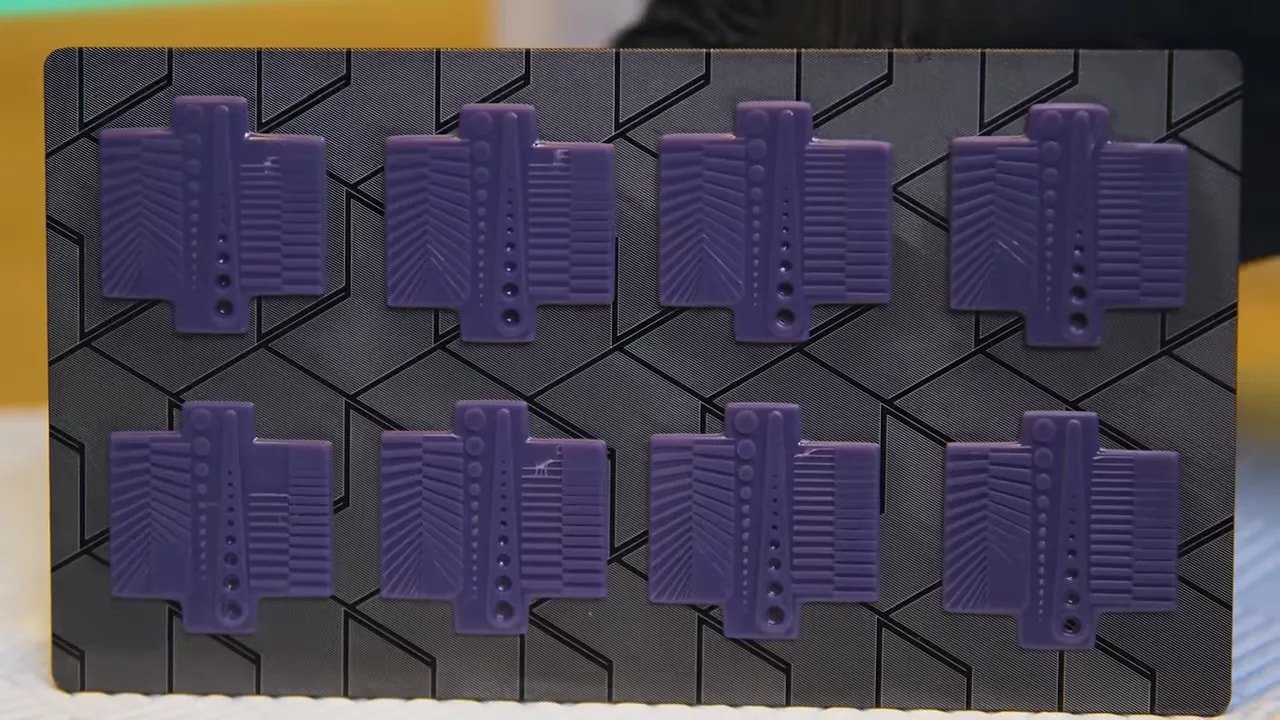 Anycubic Photon Mono 4 test prints laid out on a grid display
