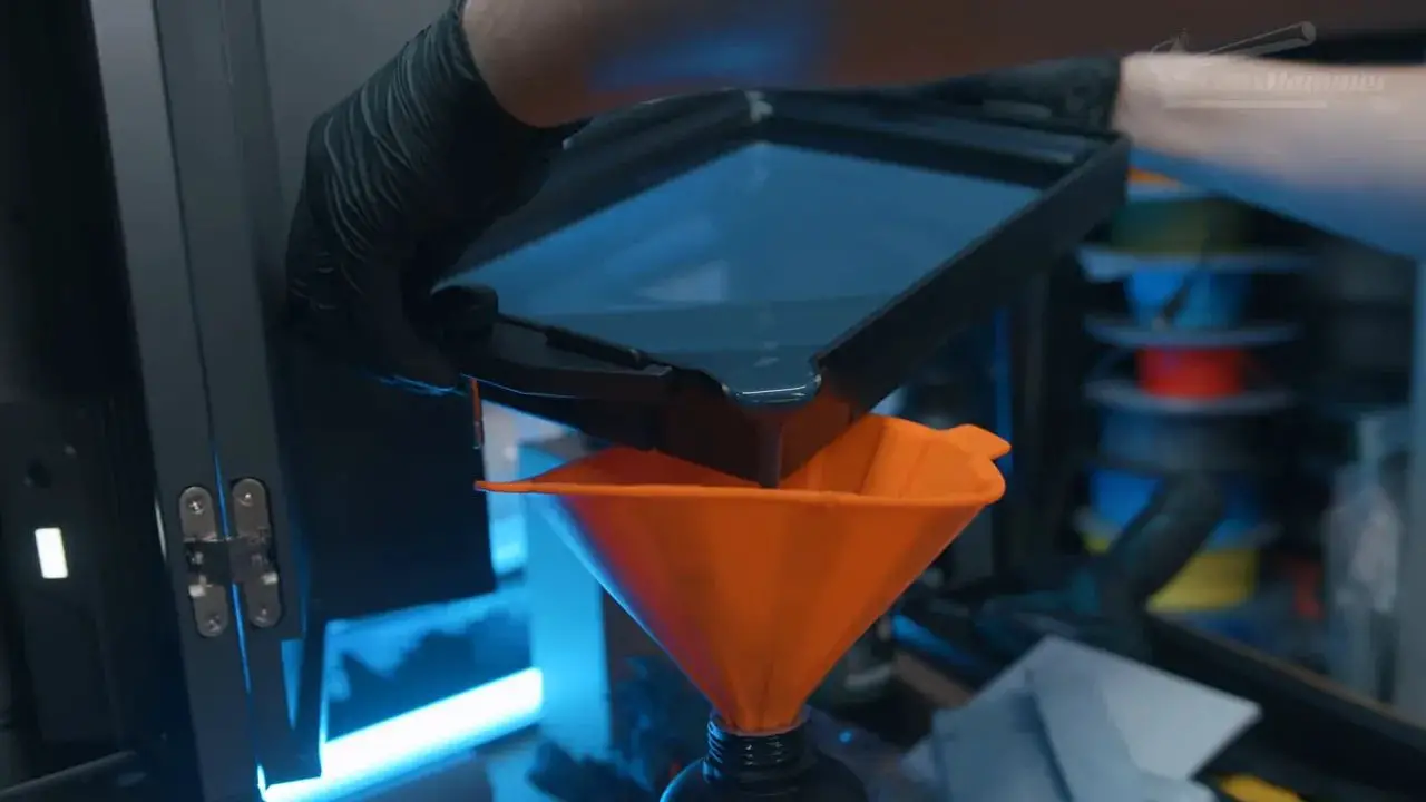 Orange resin pour funnel positioned at the Elegoo Jupiter 2 vat opening