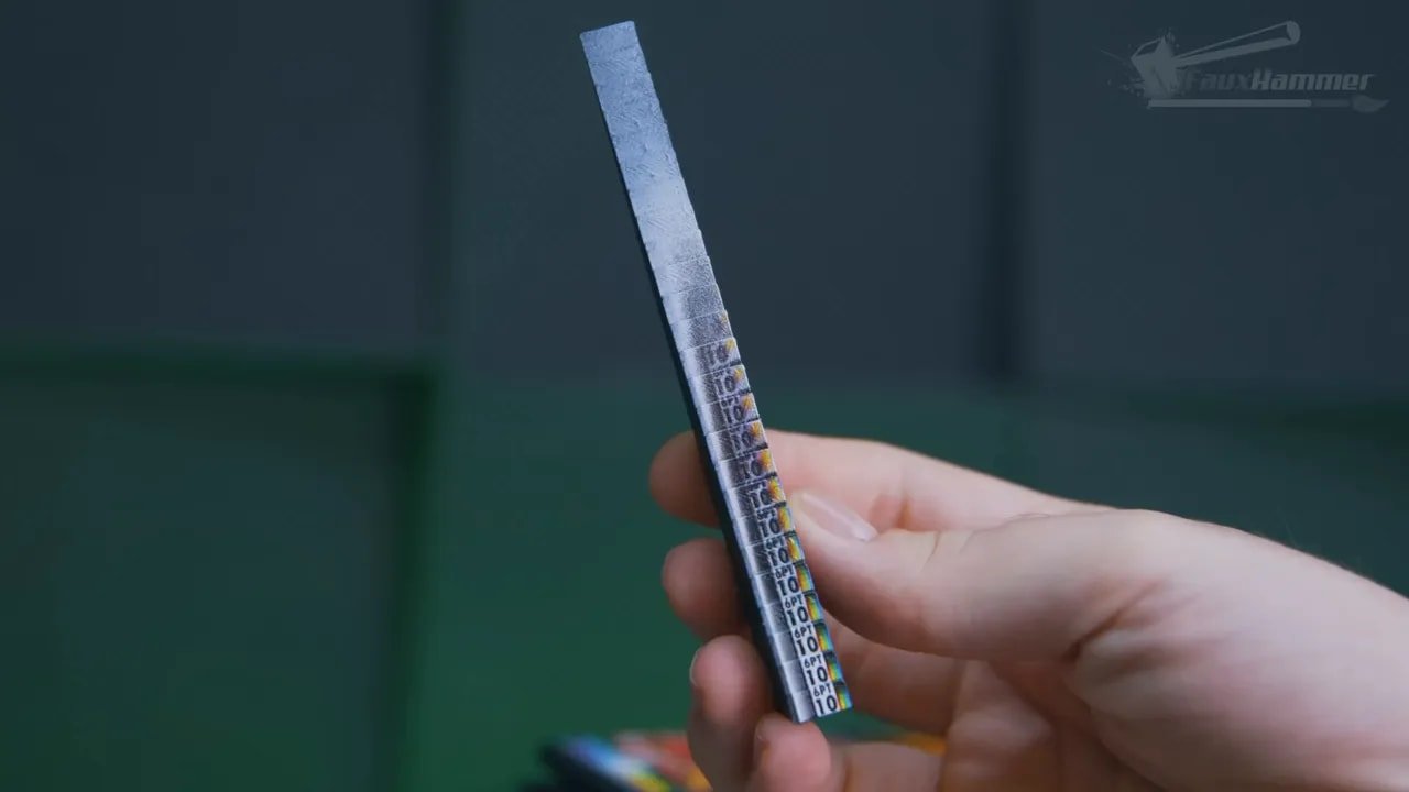 Ruler-style height test strip held in hand to show measurement markings