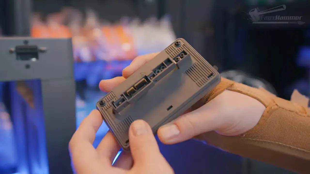 Hands installing a toolhead assembly on the FlashForge Creator 5 showing connectors and tool interface