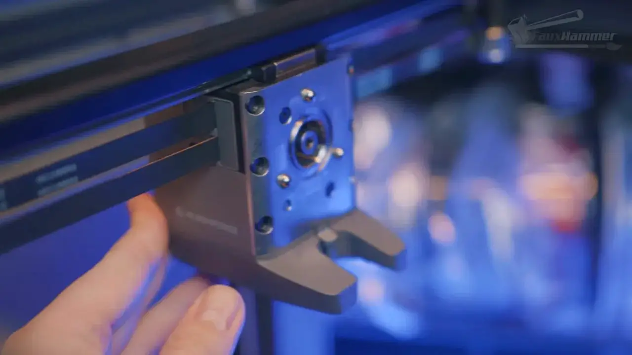 Close-up of a FlashForge Creator 5 toolchanger component with hand in view
