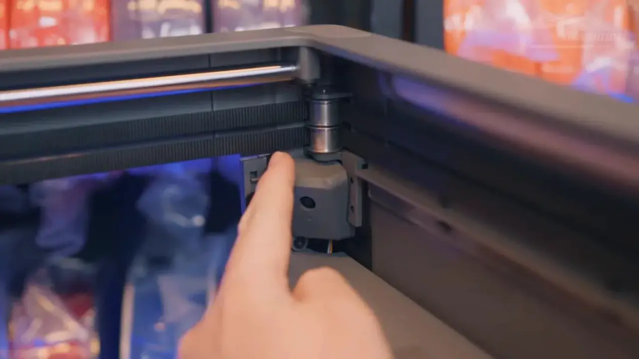 Hand pointing at the FlashForge Creator 5 toolchanger hardware on the side