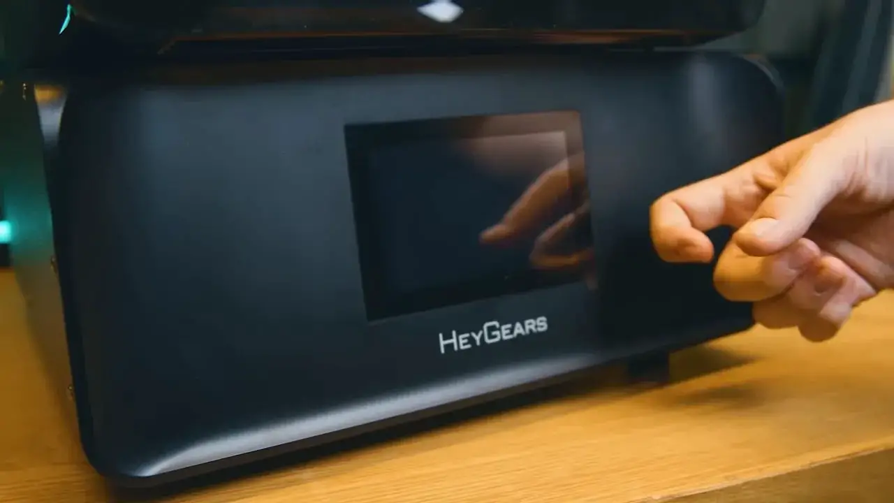 Close-up of the HeyGears Reflex RS printer display and branding