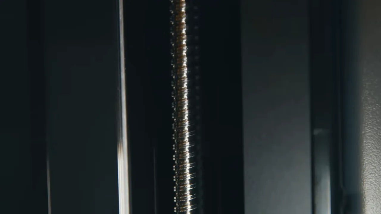 Close-up of the HeyGears Reflex RS Z-axis ball screw and precision motion components
