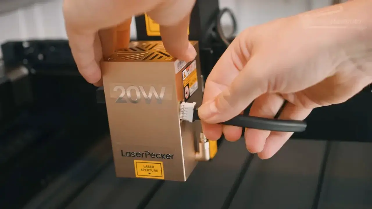 Installing a 20W LaserPecker LX2 laser module using a tool
