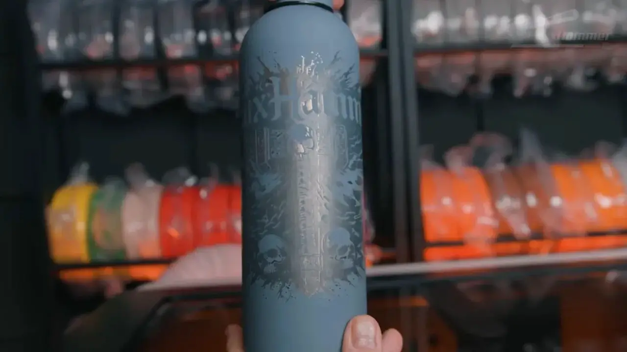 Close-up of a laser-engraved cylindrical cup with a detailed graphic in the LaserPecker LX2 test