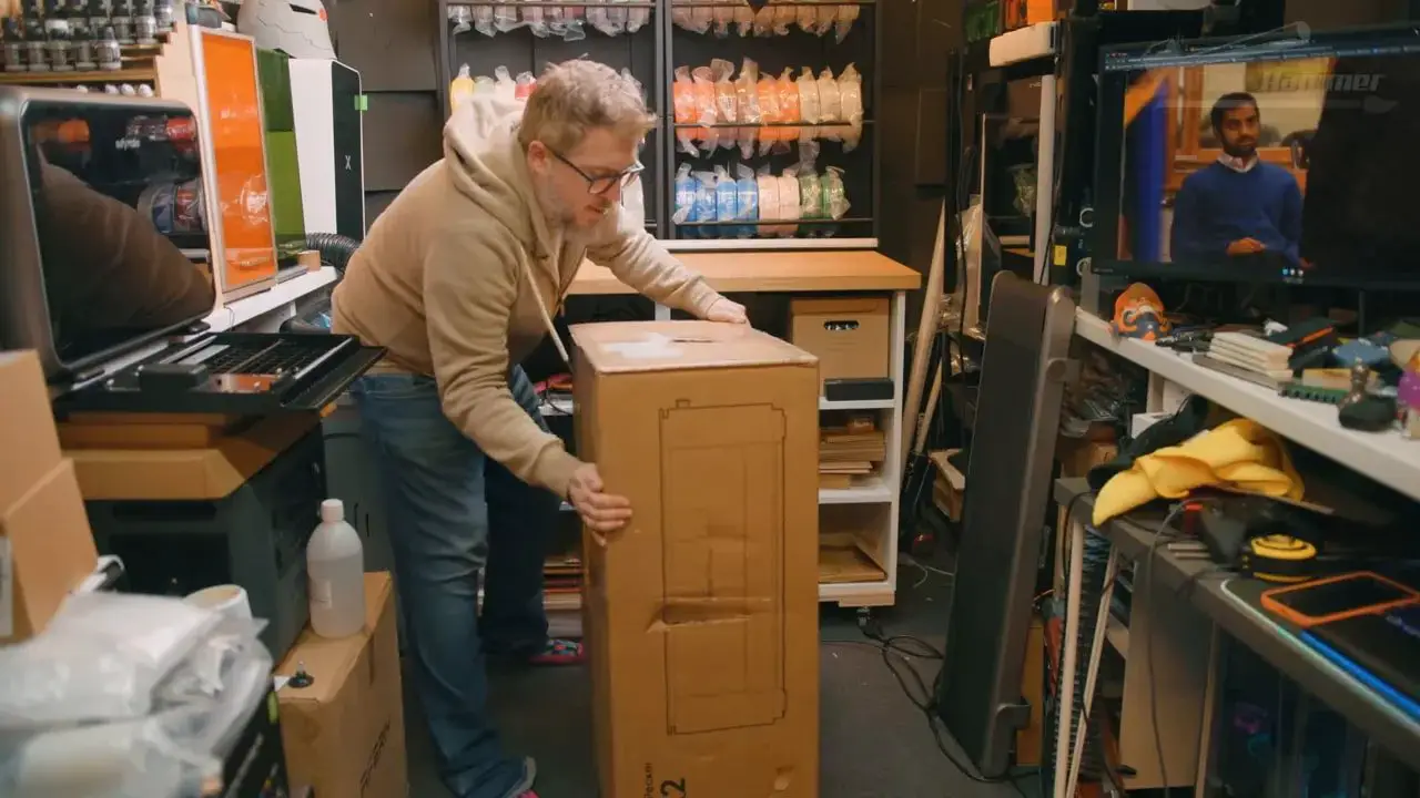 Unboxing the LaserPecker LX2 carton in a workshop