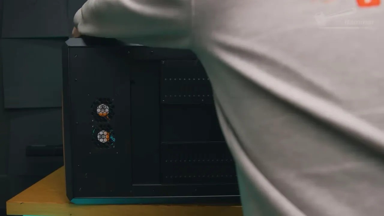 Prusa Core One enclosed printer showing dark panels and cooling fan area