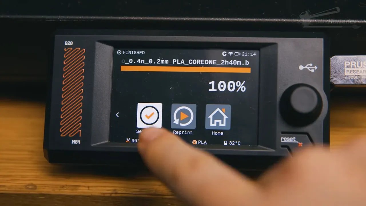 Prusa Core One touchscreen showing 100% finished status and reprint controls