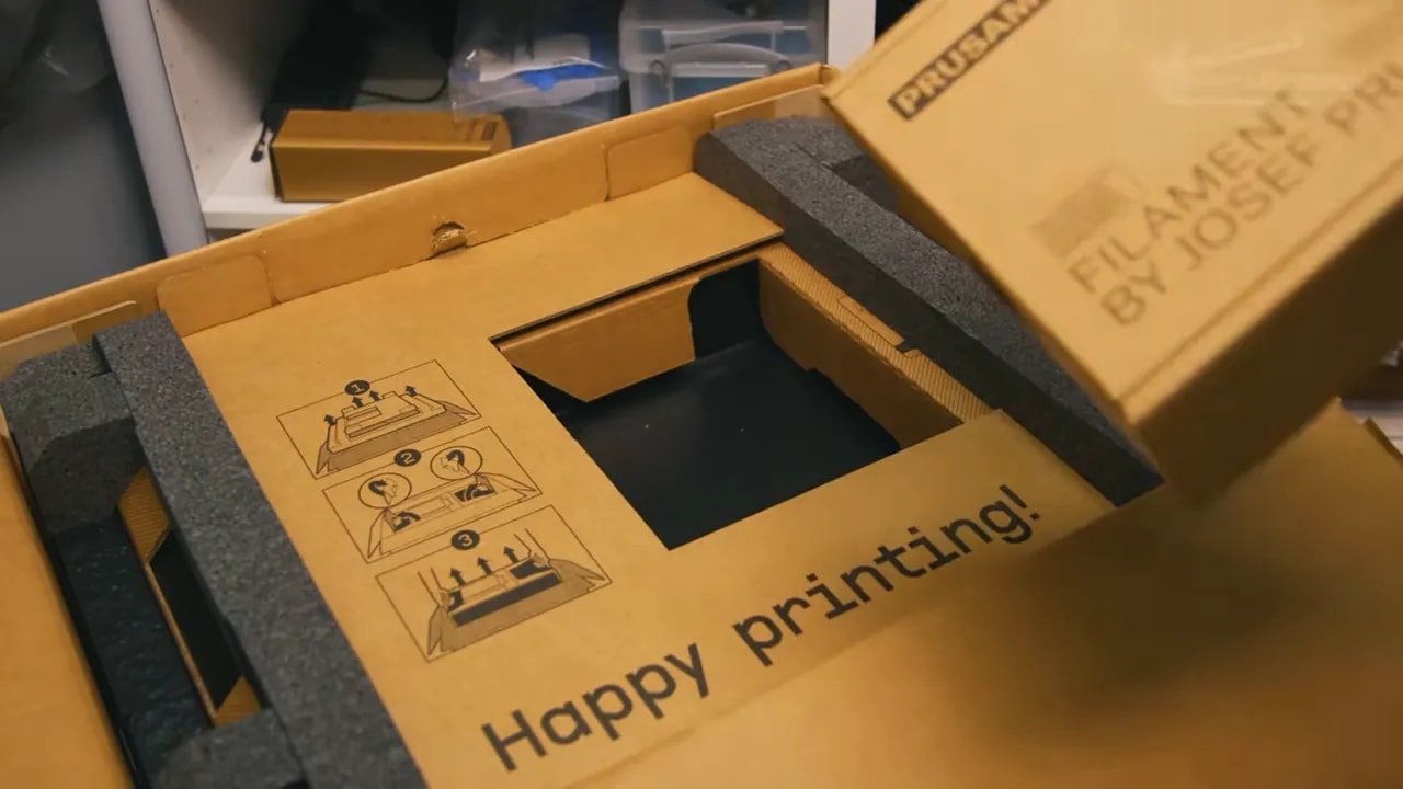 Prusa Core One unboxing packaging insert with step-by-step diagrams