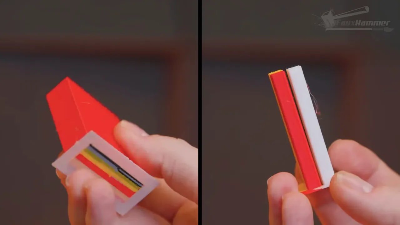 Close-up of a multi-colour 3D printed strip prop held in hands