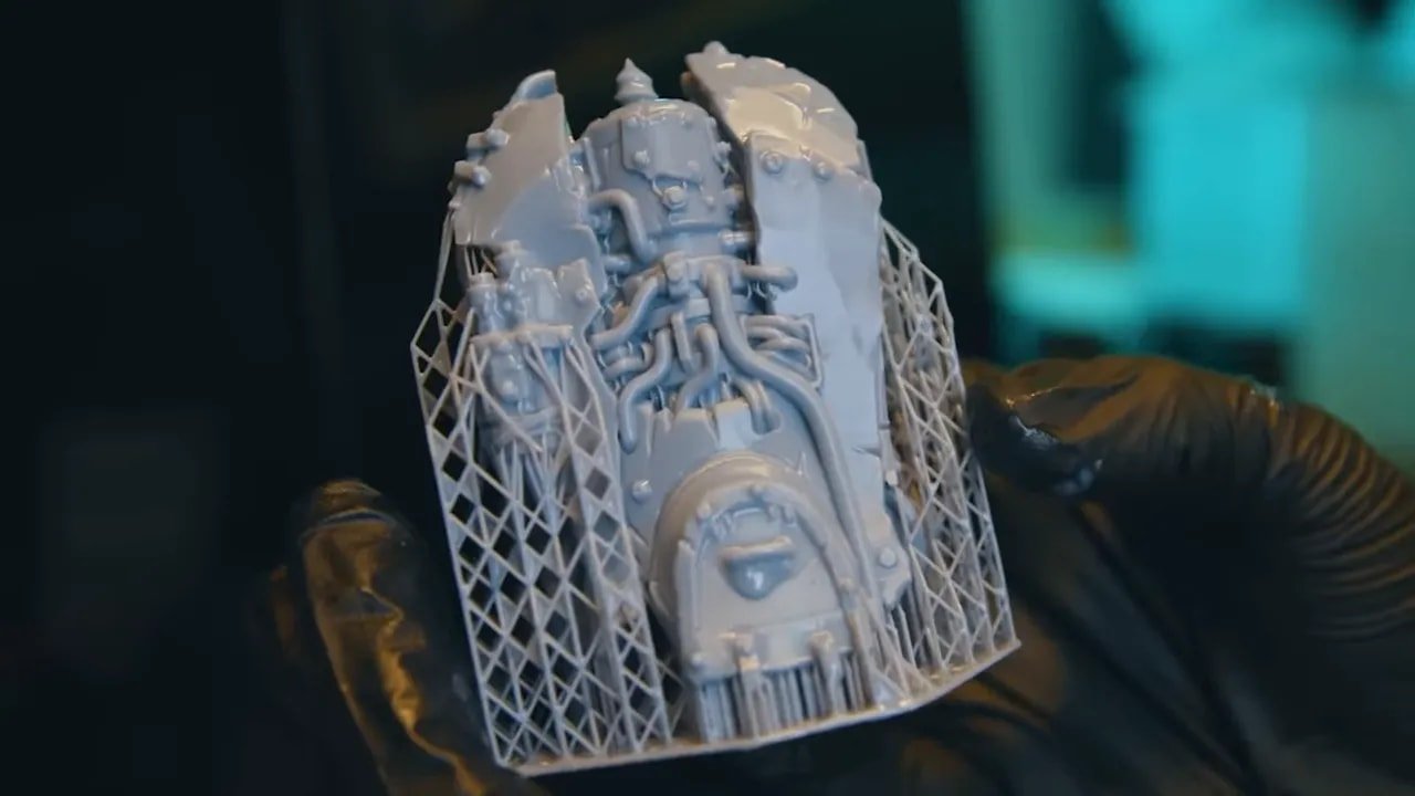 Supported miniature test print showing model details and support contacts