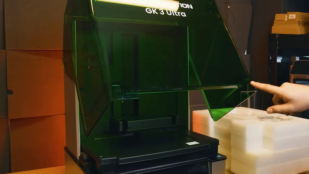 Uniformation GK3 Ultra with lid open showing the large enclosed chamber and build area