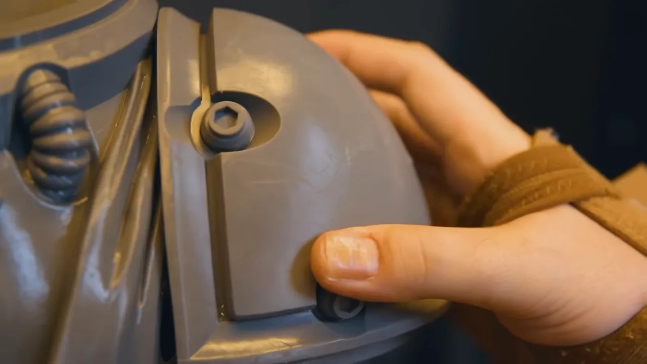 Uniformation GK3 Ultra resin system latch shown with hand close-up