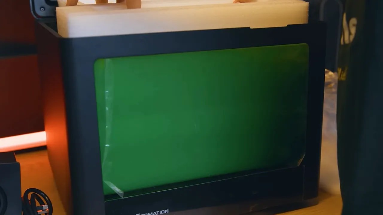 Uniformation GK3 Ultra vat in a closed enclosure with green-tinted resin