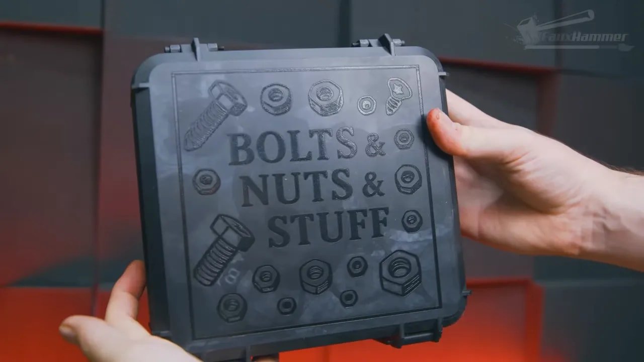 Hand holding a touchscreen showing a laser engraving design on the xTool F1 Ultra