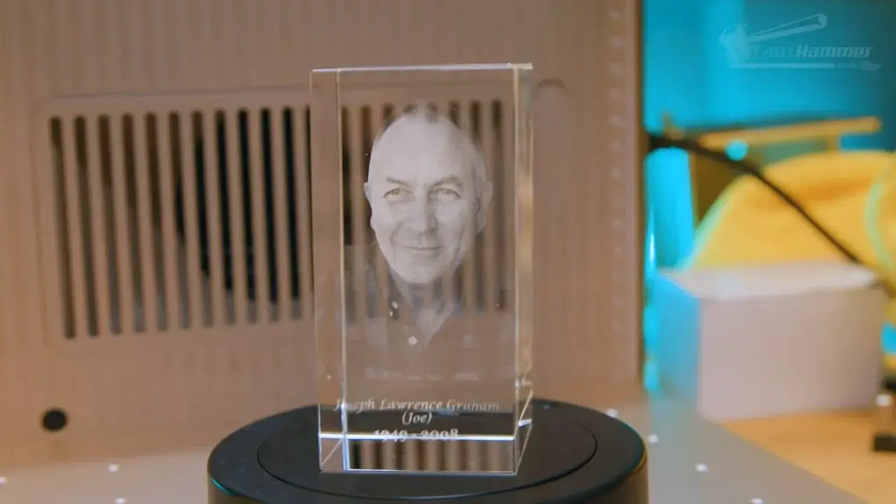 Wider view of a portrait engraving inside the xTool F2 Ultra UV using a clear acrylic/crystal-style block